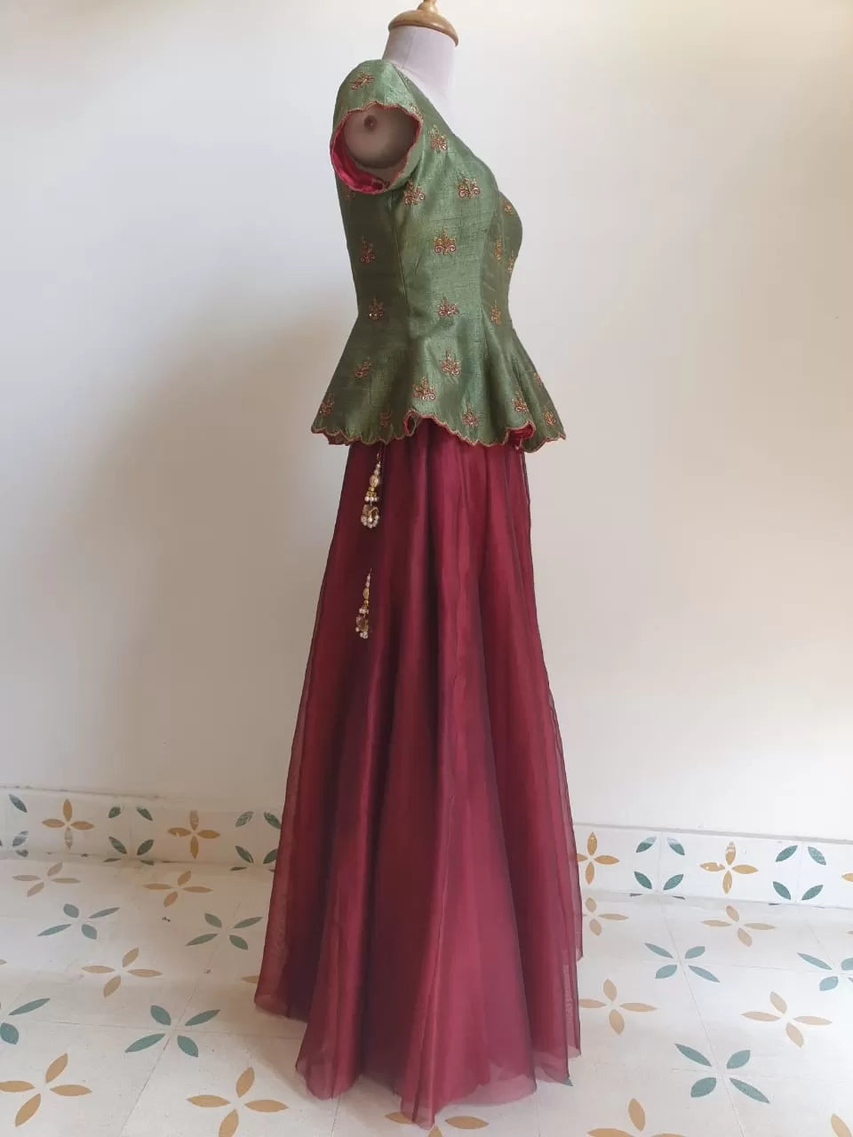 Regal Green Embroidered Peplum Corset with maroon skirt