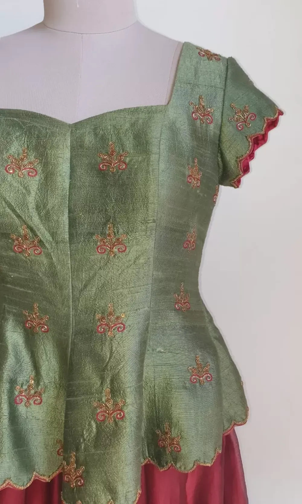 Regal Green Embroidered Peplum Corset with maroon skirt